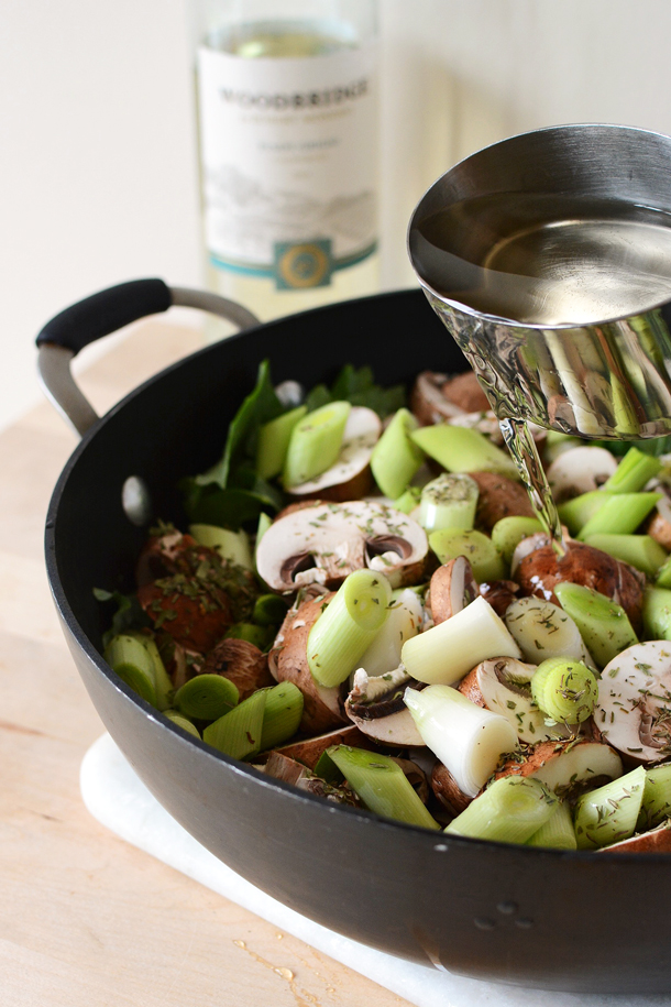 Pouring White Wine over Vegetables for Cooking