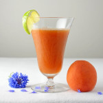 apricot cocktail with blue flower and apricot