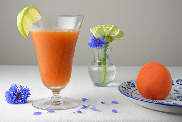 apricot cocktail with blue flowers