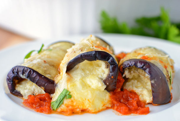 This amazing, lightened-up Italian dish combines the flavors of eggplant parmesan and stuffed shells. This recipe is one of our favorites because it's naturally lighter, yet still BURSTING with cheesy goodness!