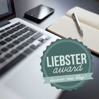 liebster award logo with computer and notebook