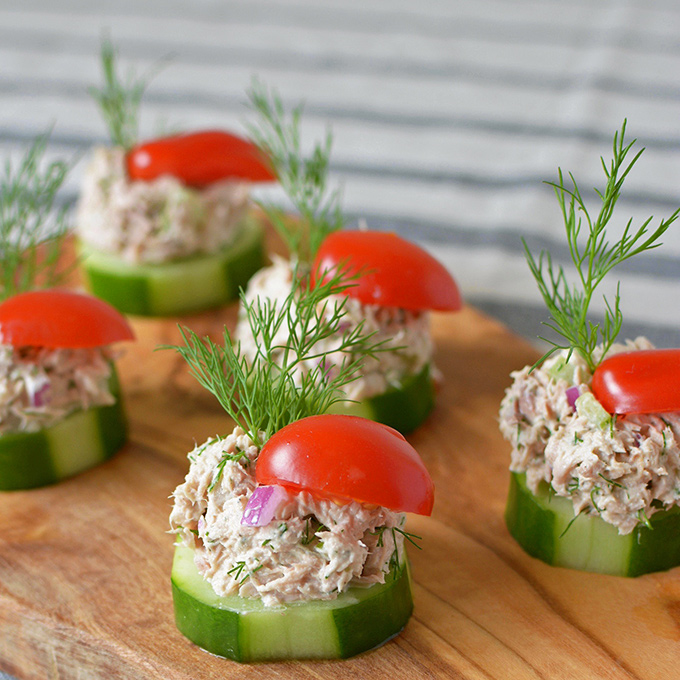 Cucumber Tuna Salad Bites - When the summer heat is at its peak, sometimes you just don't feel like cooking. Thankfully, these tasty little party appetizers are cool, crunchy, and require ZERO oven time! | SimpleSeasonal.com