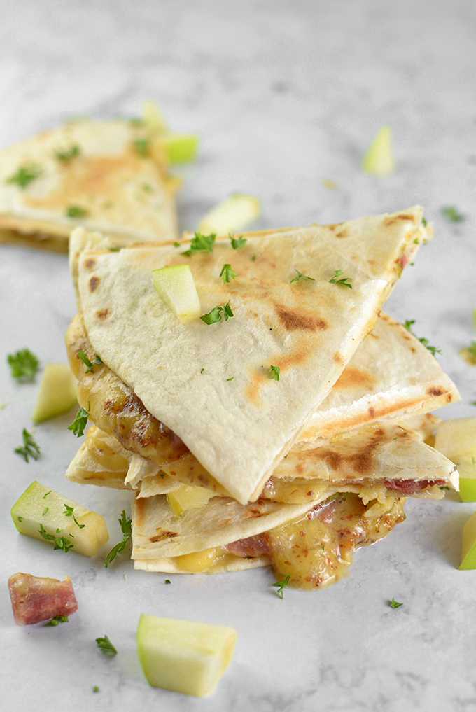 Honey Ham, Gouda, and Apple Quesadillas - Trying to figure out what to do with that leftover ham? Turn it into a quick, easy, and delicious appetizer with this fun spring recipe!