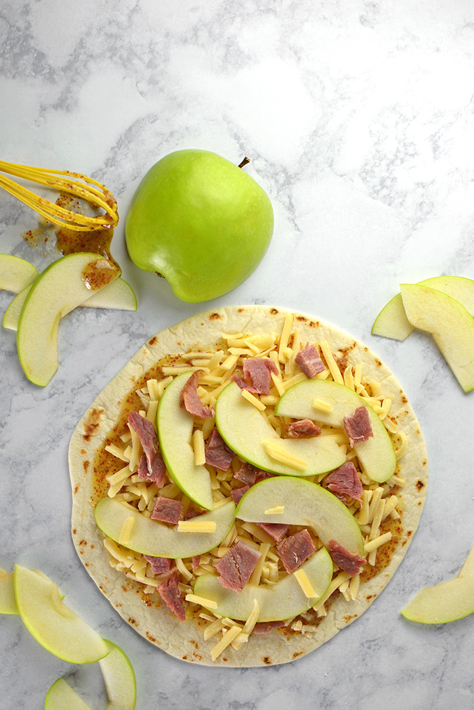 Honey Ham, Gouda, and Apple Quesadillas - Trying to figure out what to do with that leftover ham? Turn it into a quick, easy, and delicious appetizer with this fun spring recipe!