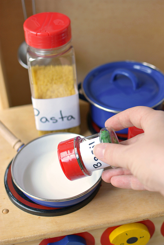 Play Kitchen Upcycled Spice Jars - Give your empty spice jars a new life with this fun craft for kids that will encourage conservation and imaginative play!