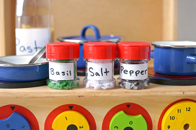 Play Kitchen Upcycled Spice Jars - Give your empty spice jars a new life with this fun craft for kids that will encourage conservation and imaginative play!