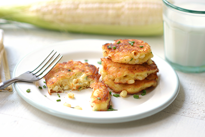 Corn fritters with chives on a plate