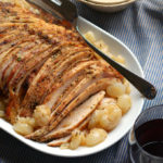 slow cooker boneless turkey breast with gravy on a plate