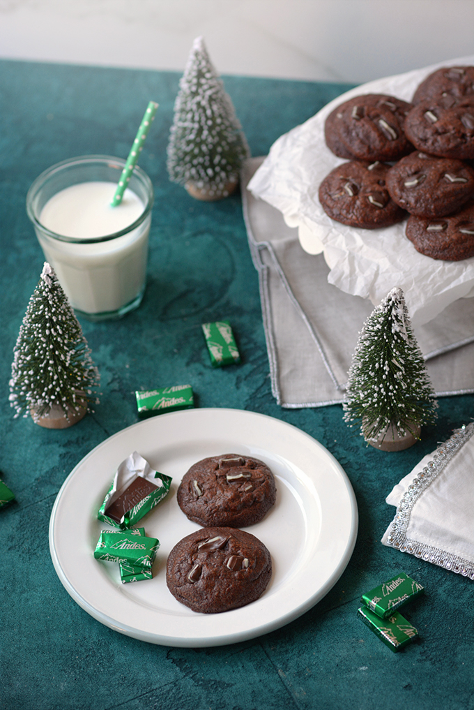 Two Triple-Chocolate Andes Mint Cookies on a plate with Andes mints.