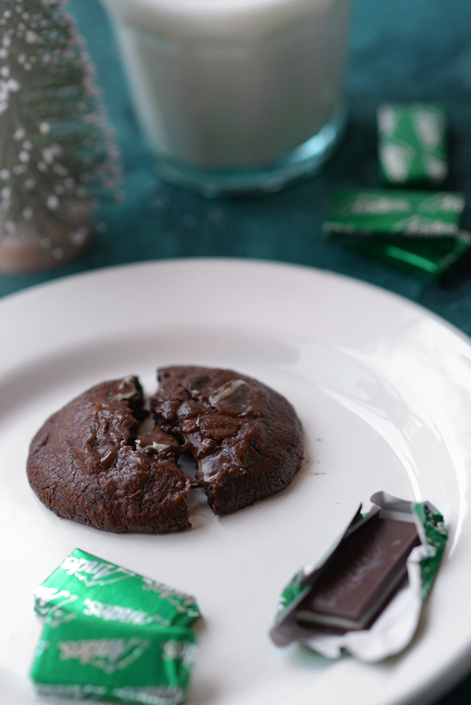 Triple-Chocolate Andes Mint Cookie on a plate with an unwrapped Andes mint next to it.