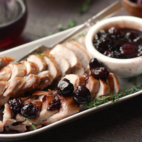 pork tenderloin with cherry sauce on a plate