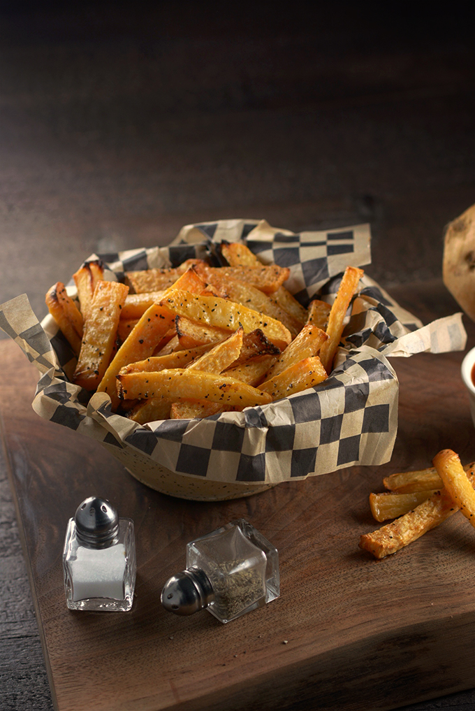 Vertical Picture of Baked Rutabaga Fries in a Basket