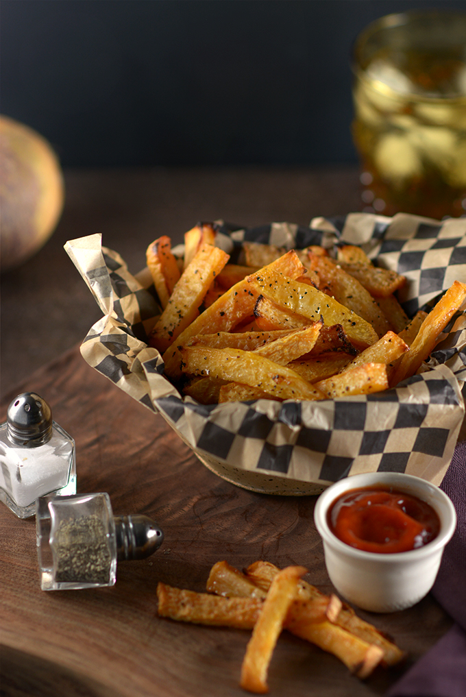 Rutabaga Fries on a Table with Ketchup, Salt, and Pepper