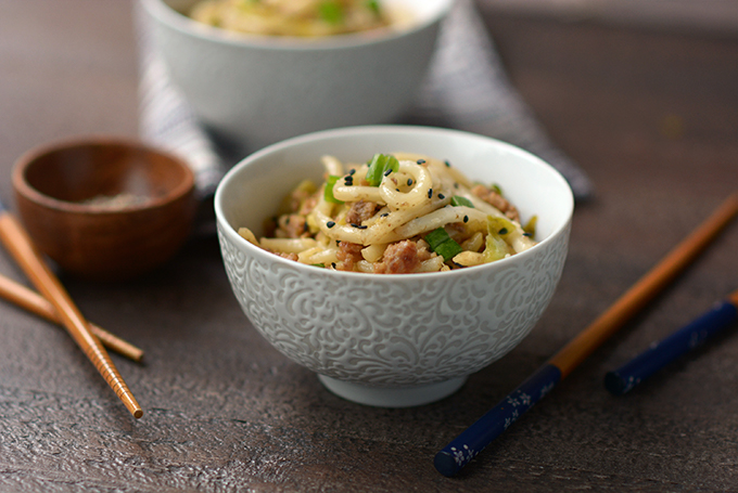 Pork and Cabbage Udon Noodles with Black Sesame Seeds in a bowl