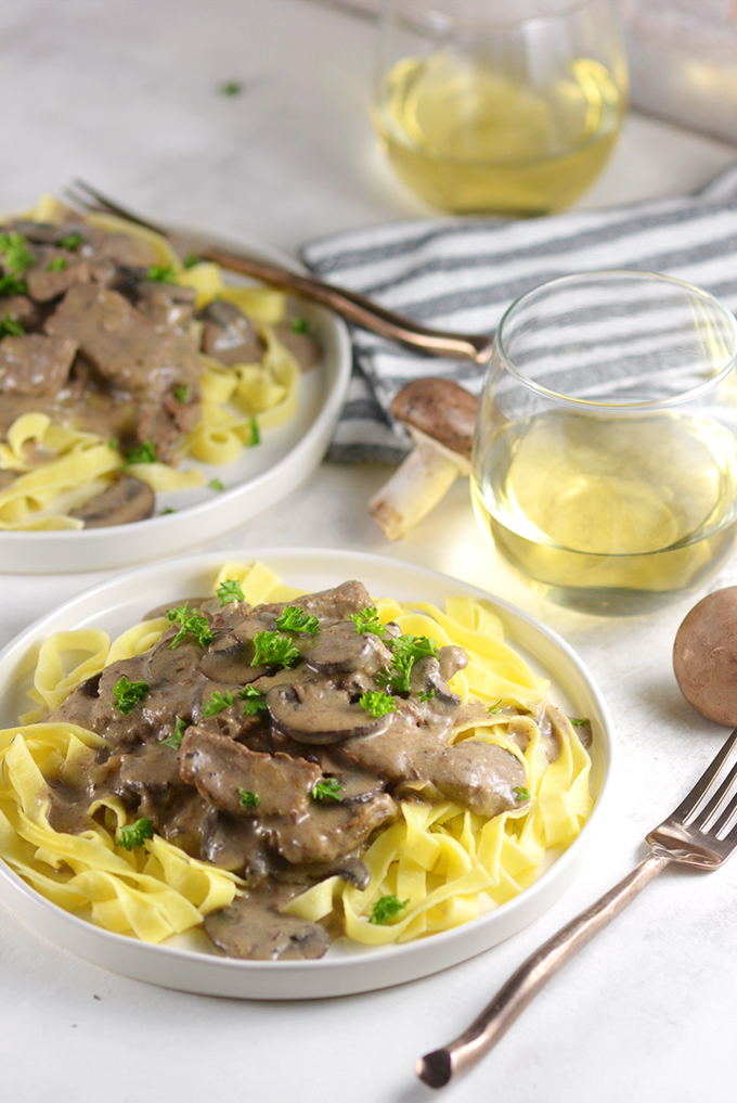 plate-of-beef-stroganoff-and-noodles-and-wine