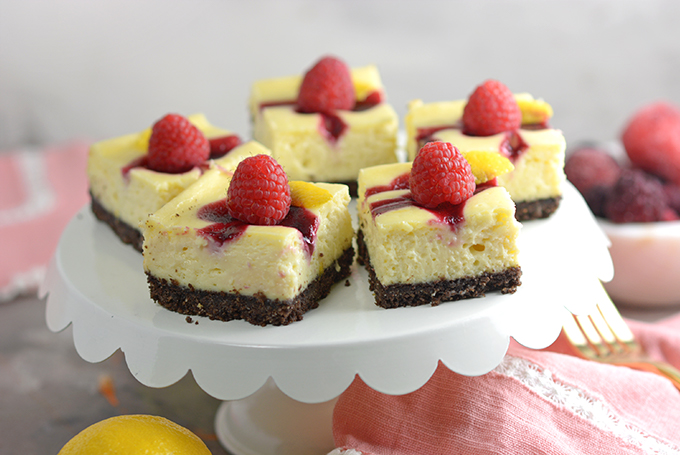 Horizontal Image of a Tray of Berry Swirl Cheesecake Bars
