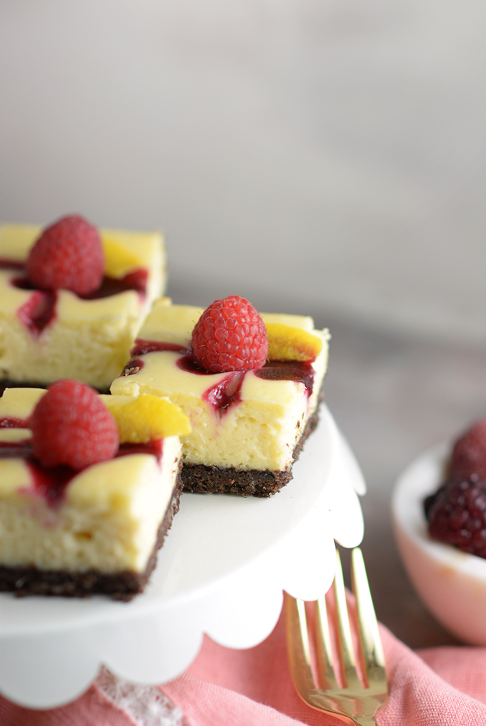 Berry Swirl Cheesecake Bars Close Up on a Tray