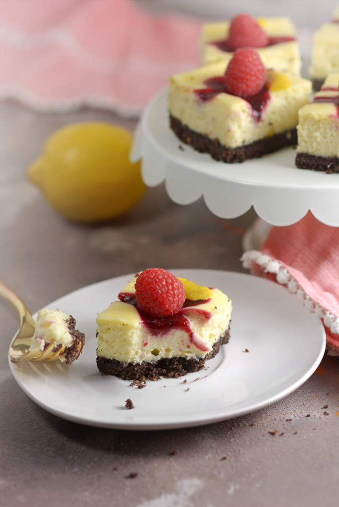 Berry Swirl Cheesecake Bars with a Bite Eaten