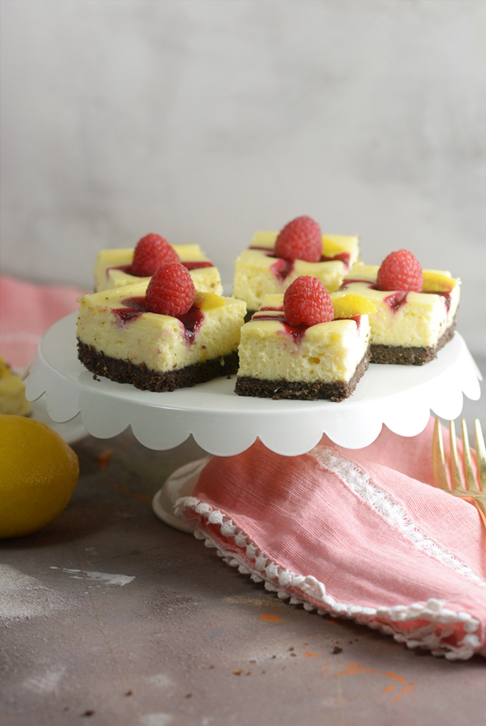 Berry Swirl Cheesecake Bars on a Tray