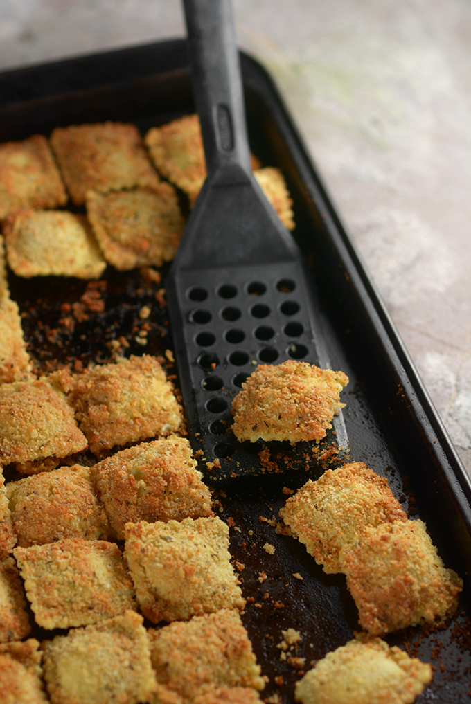 sheet pan with baked ravioli on it