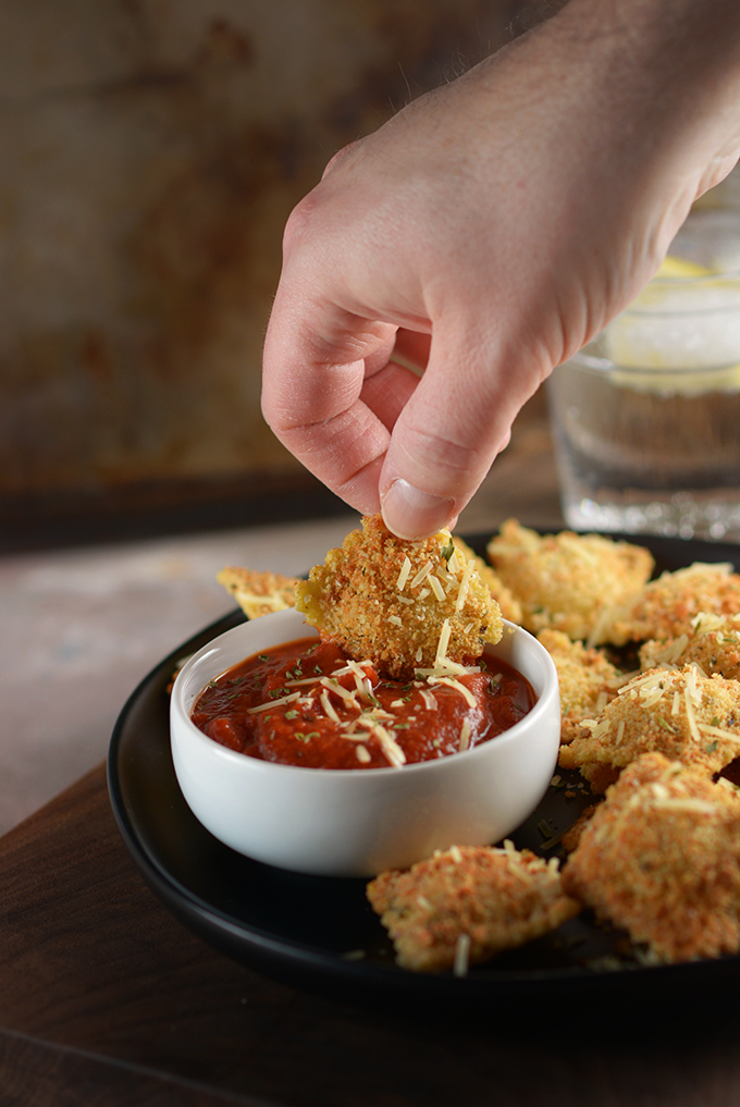 hand dipping baked ravioli