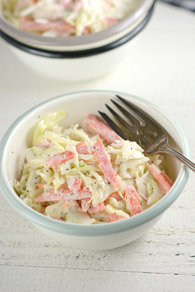 Homemade Coleslaw in a small bowl with a fork