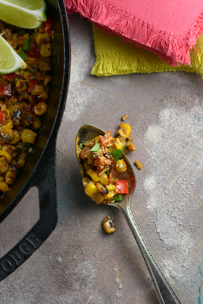 Closeup of Loaded Skillet Mexican Street Corn on a spoon